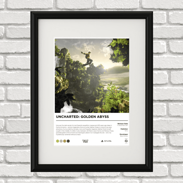 Image of a custom Uncharted Golden Abyss print in a black frame mounted on a white brick wall