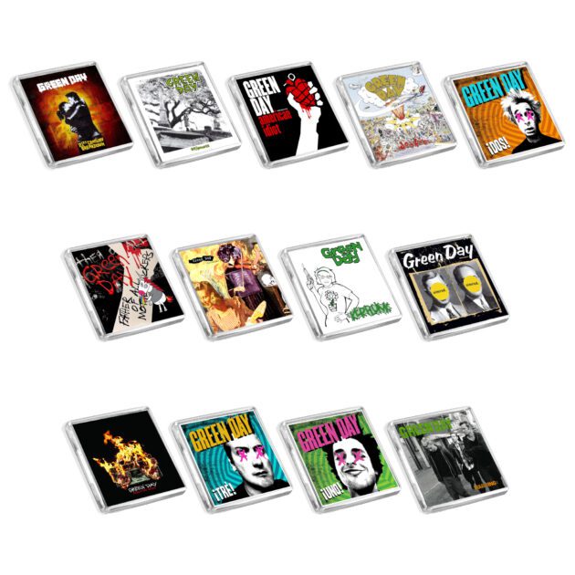 Set of 13 Green Day album cover-inspired fridge magnets on a white background