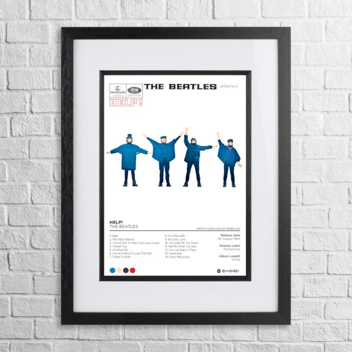 A4 custom design poster of The Beatles - Help in a black, dual-aspect frame on a white brick background