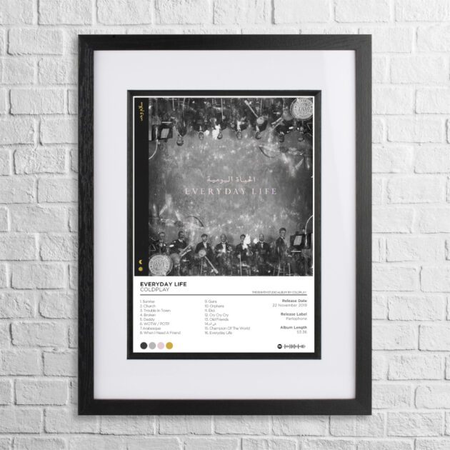 A4 custom design poster of Coldplay - Everyday Life in a black, dual-aspect frame on a white brick background