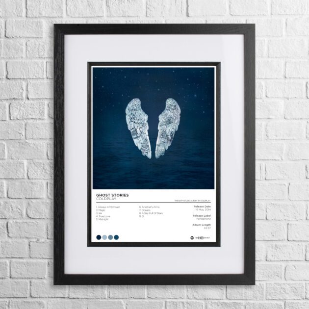 A4 custom design poster of Coldplay - Ghost Stories in a black, dual-aspect frame on a white brick background