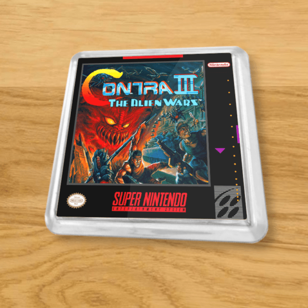Plastic Contra 3 coaster on a wood table