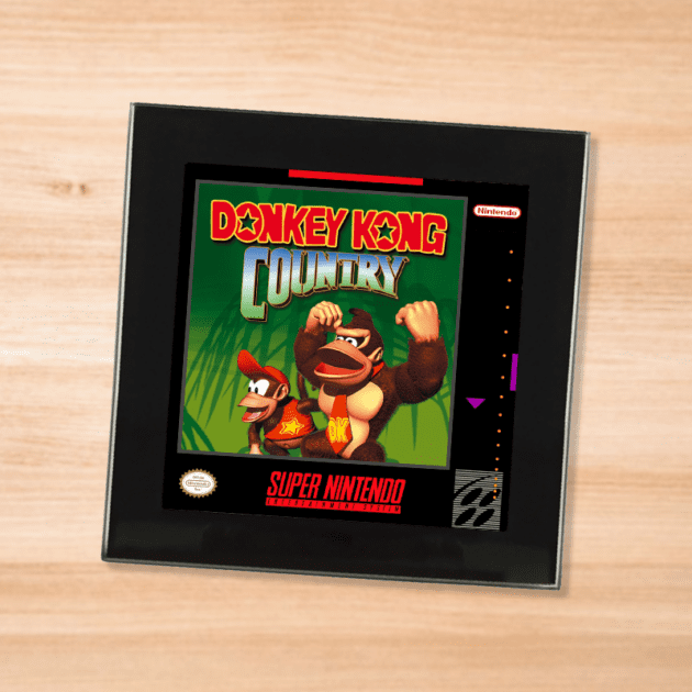 Black glass Donkey Kong Country coaster on a wood table