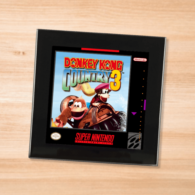 Black glass Donkey Kong Country 3 coaster on a wood table