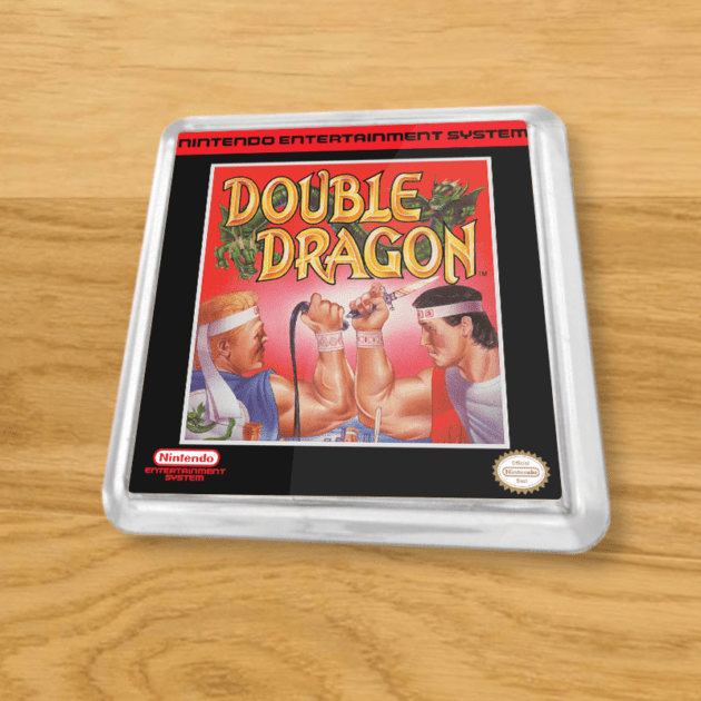 Plastic Double Dragon coaster on a wood table