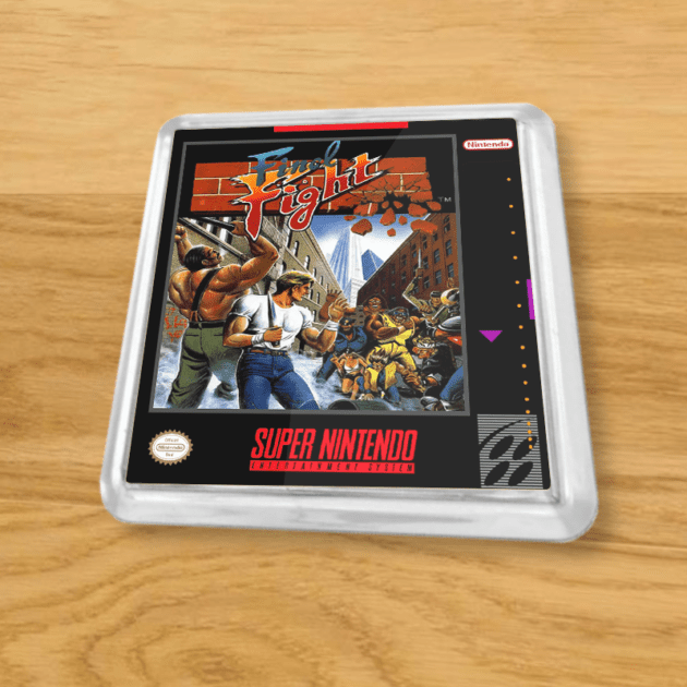 Plastic Final Fight coaster on a wood table