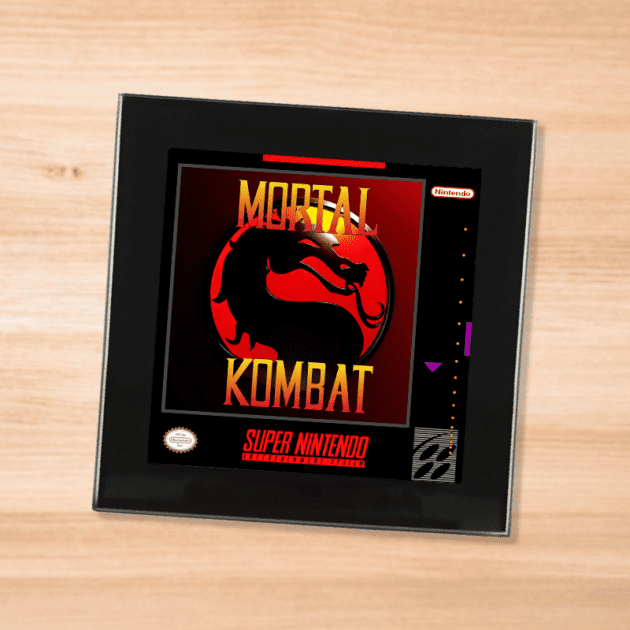 Black glass Mortal Kombat coaster on a wood table