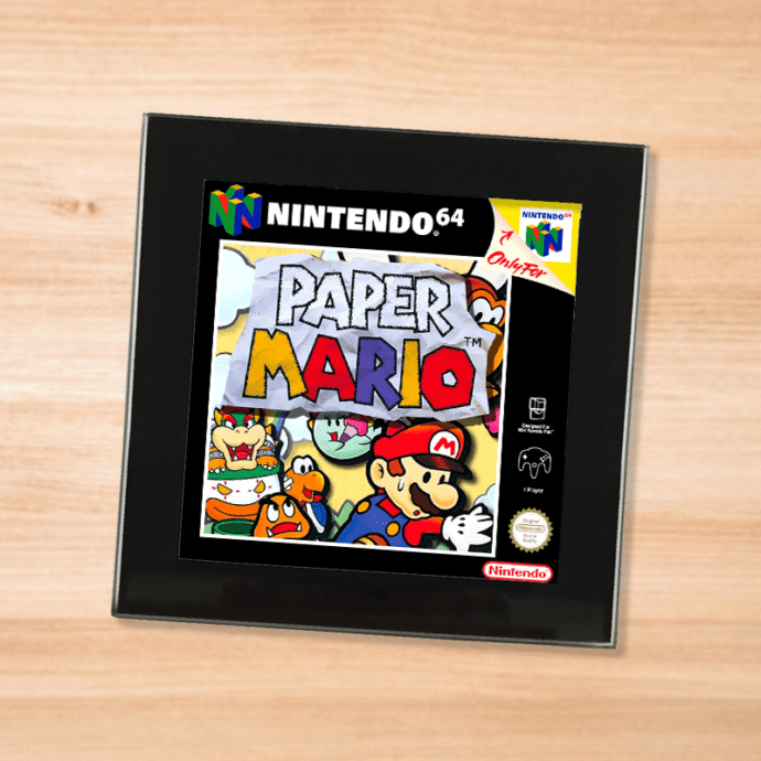 Black glass Paper Mario coaster on a wood table
