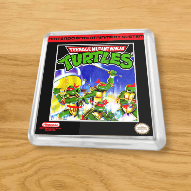 Plastic Teenage Mutant Ninja Turtles coaster on a wood table