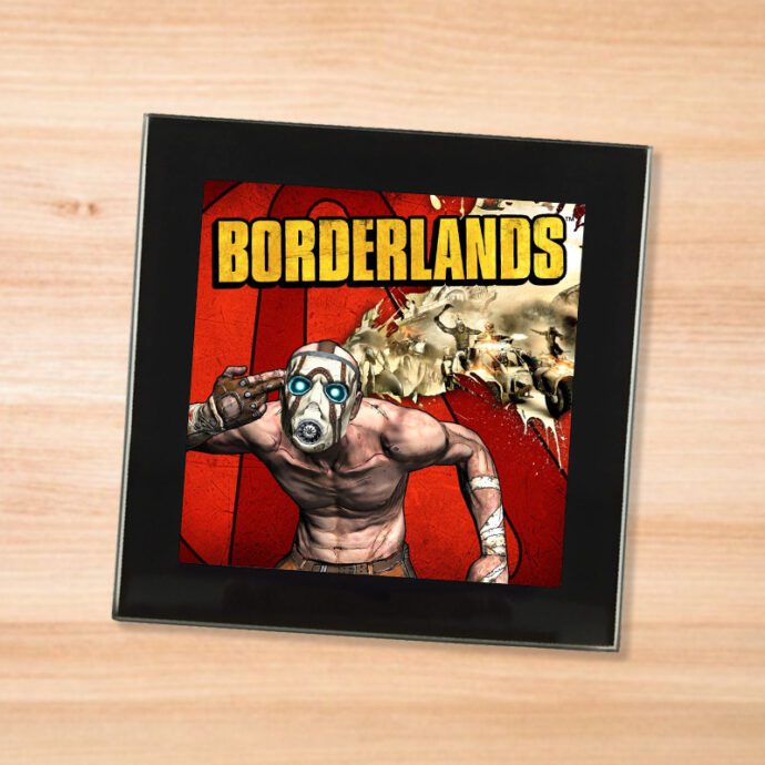 Black glass Borderlands coaster on a wood table