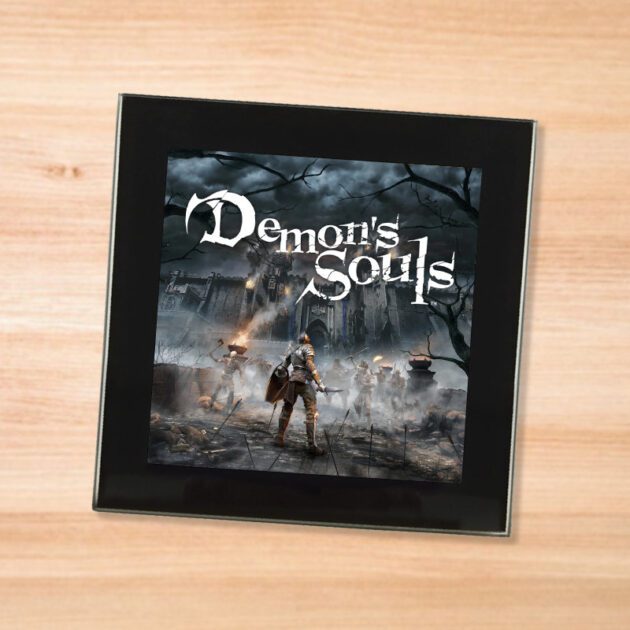 Black glass Demon's Souls coaster on a wood table