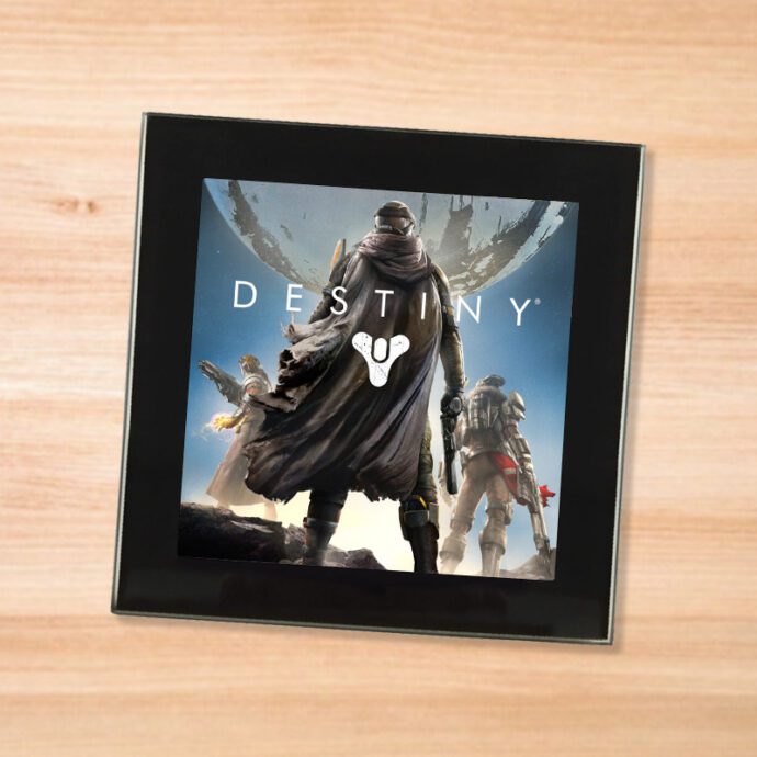 Black glass Destiny coaster on a wood table