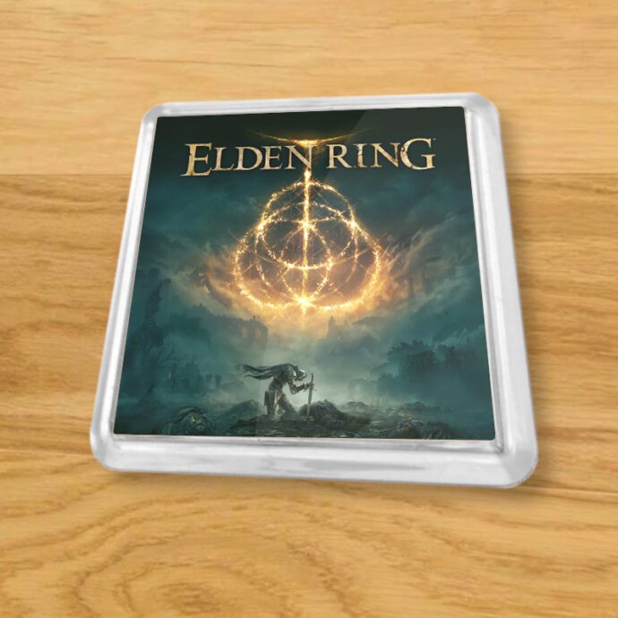 Plastic Elden Ring coaster on a wood table