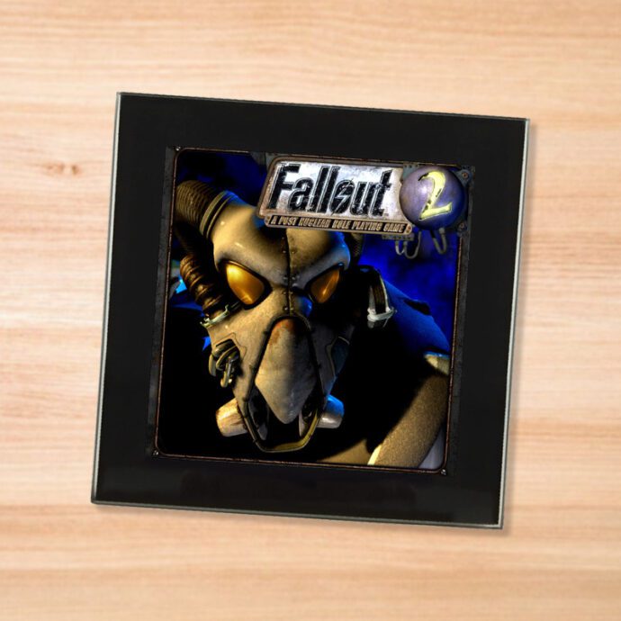 Black glass Fallout 2 coaster on a wood table