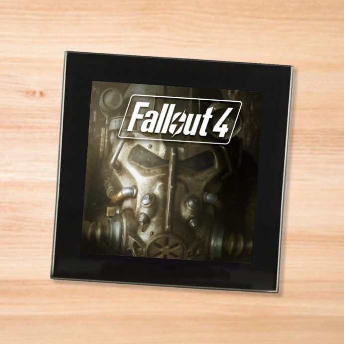 Black glass Fallout 4 coaster on a wood table