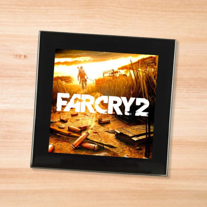 Black glass Far Cry 2 coaster on a wood table