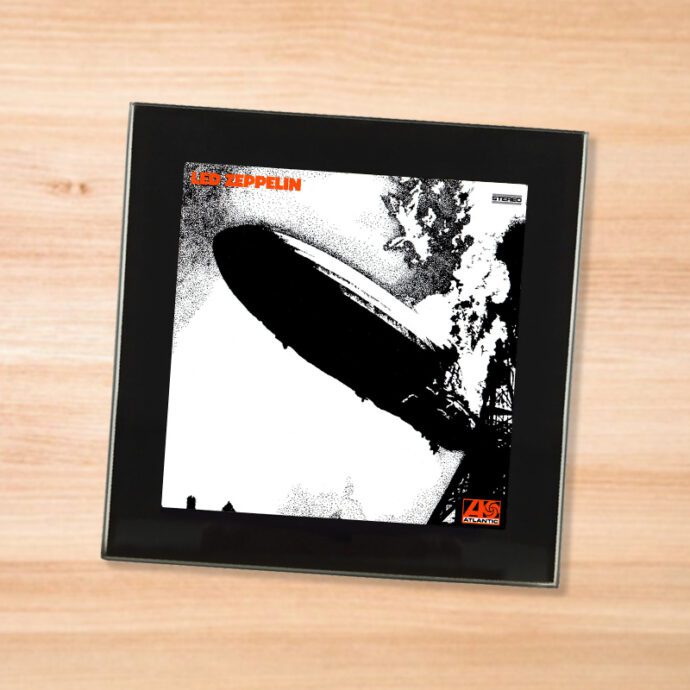 Black glass Led Zeppelin - I coaster on a wood table