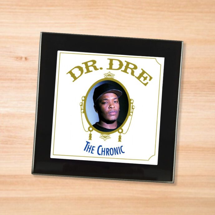 Black glass Dr. Dre - The Chronic coaster on a wood table