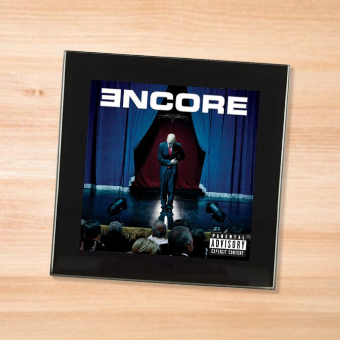 Black glass Eminem - Encore coaster on a wood table
