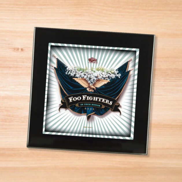 Black glass Foo Fighters - In Your Honor coaster on a wood table