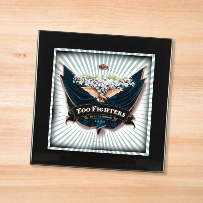 Black glass Foo Fighters - In Your Honor coaster on a wood table