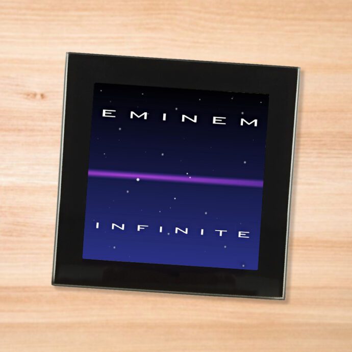 Black glass Eminem - Infinite coaster on a wood table