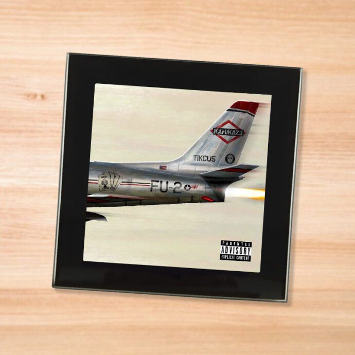 Black glass Eminem - Kamikaze coaster on a wood table