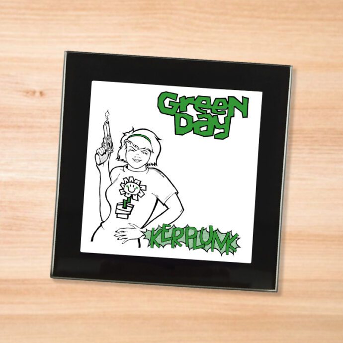 Black glass Green Day - Kerplunk coaster on a wood table