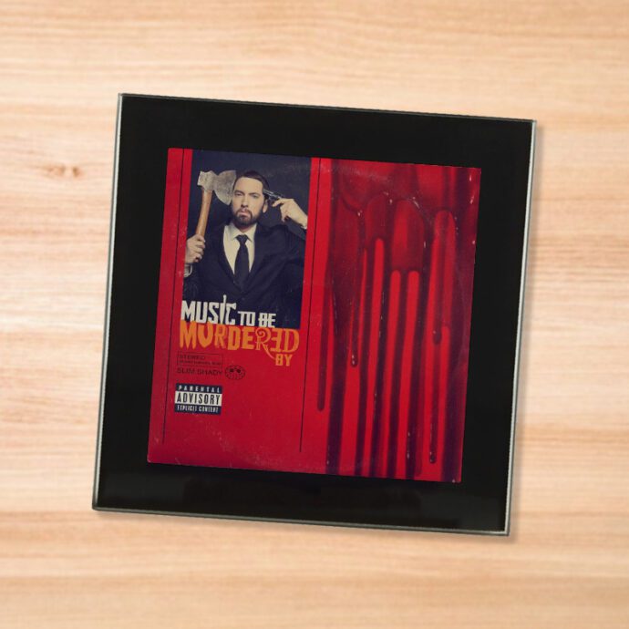 Black glass Eminem - Music to be Murdered By coaster on a wood table