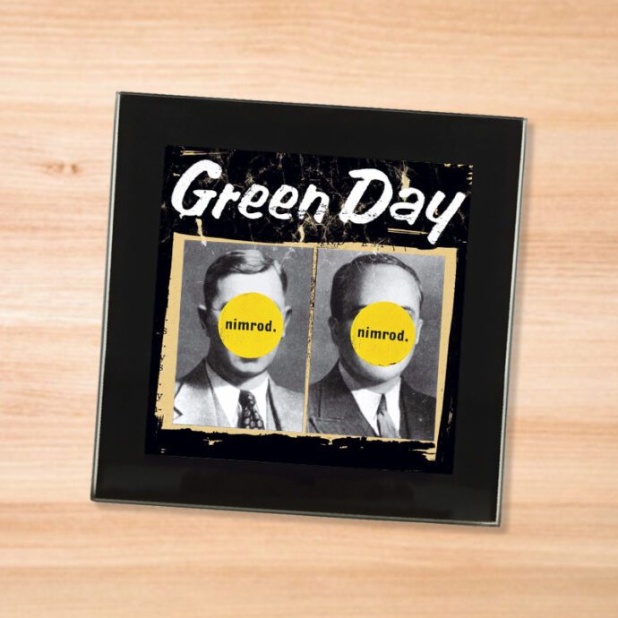 Black glass Green Day - Nimrod coaster on a wood table