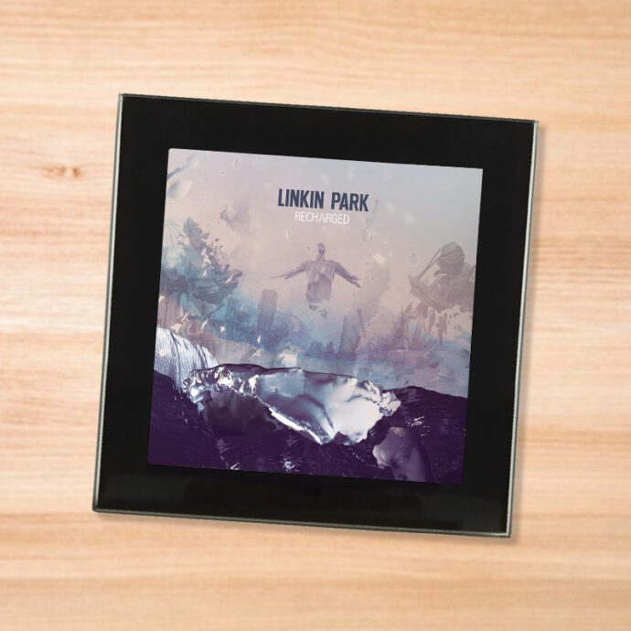 Black glass Linkin Park - Recharged coaster on a wood table