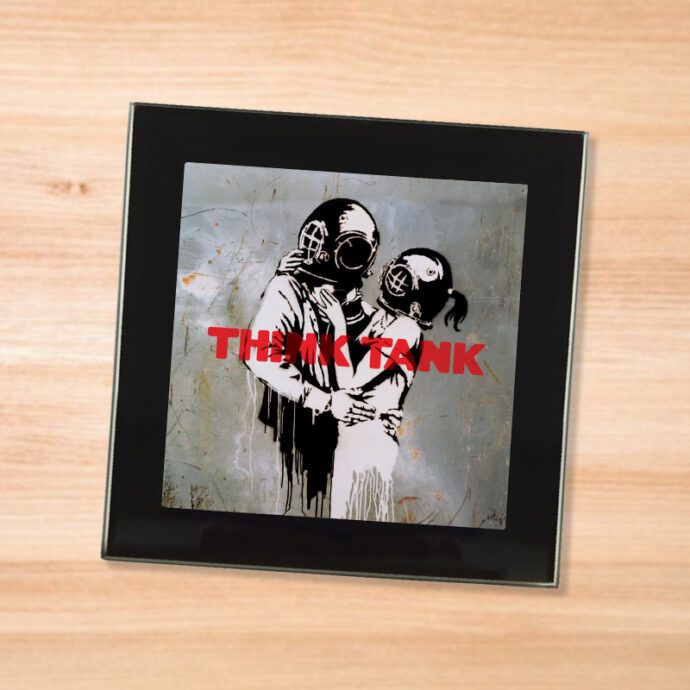 Black glass Blur - Think Tank coaster on a wood table
