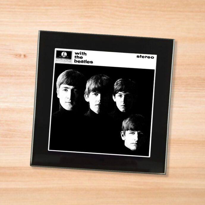 Black glass The Beatles - With the Beatles coaster on a wood table