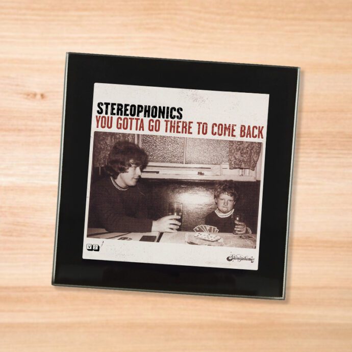 Black glass Stereophonics - JEEP coaster on a wood table