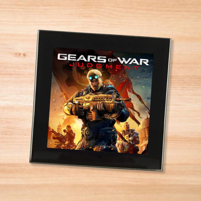 Black glass Gears of War Judgment coaster on a wood table