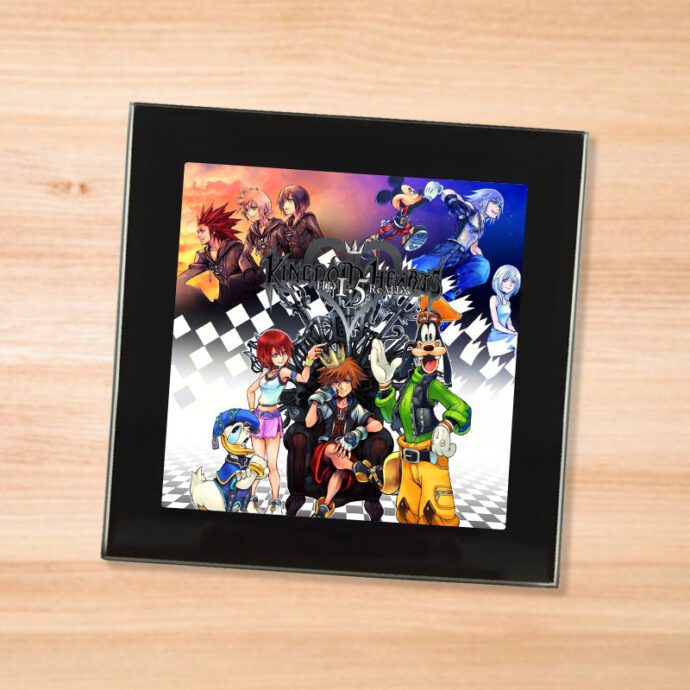 Black glass Kingdom Hearts 1.5 coaster on a wood table