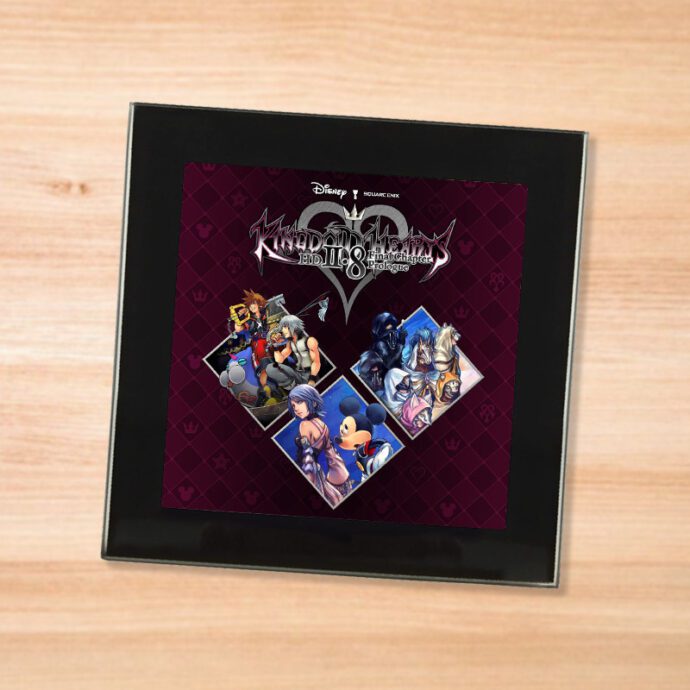 Black glass Kingdom Hearts 2.8 coaster on a wood table