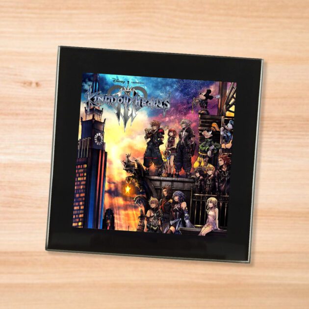 Black glass Kingdom Hearts 3 coaster on a wood table