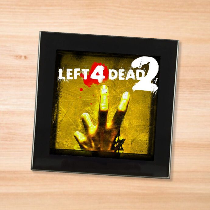 Black glass Left 4 Dead 2 coaster on a wood table