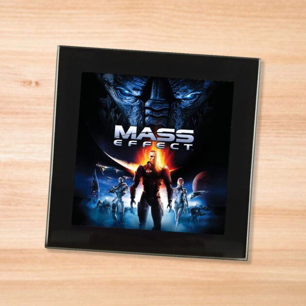 Black glass Mass Effect coaster on a wood table