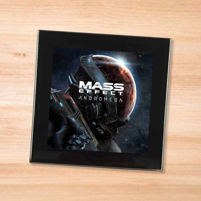 Black glass Mass Effect Andromeda coaster on a wood table