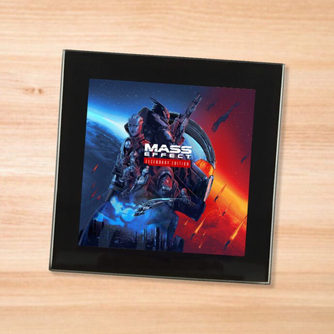 Black glass Mass Effect Legendary Edition coaster on a wood table