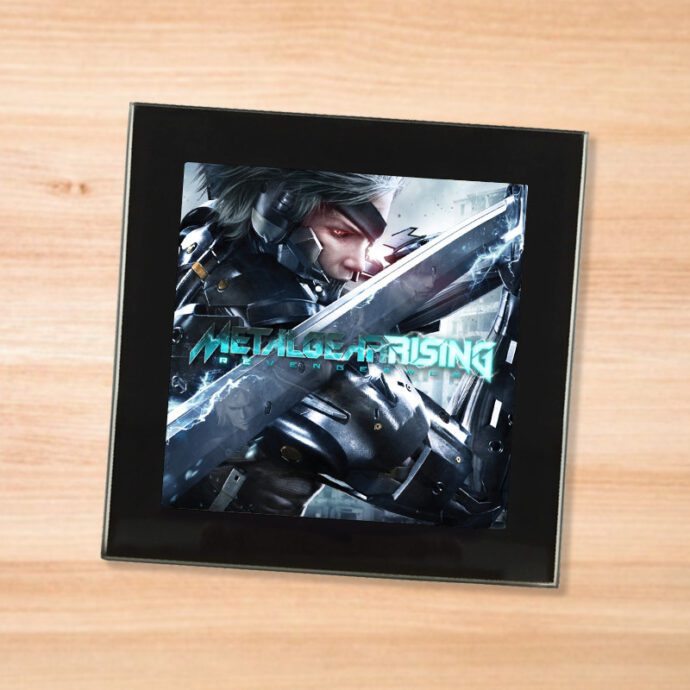 Black glass Metal Gear Rising coaster on a wood table