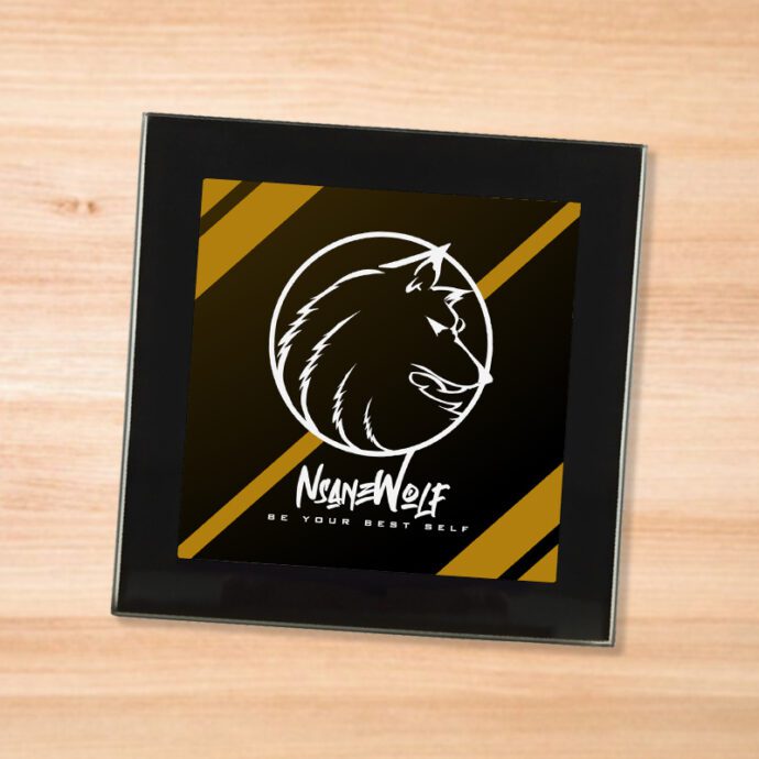 Black glass NsaneWolf - Be Your Best Self (White) logo coaster on a wood table