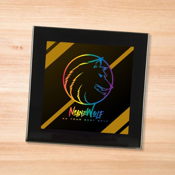 Black glass NsaneWolf - Be Your Best Self (Rainbow) logo coaster on a wood table