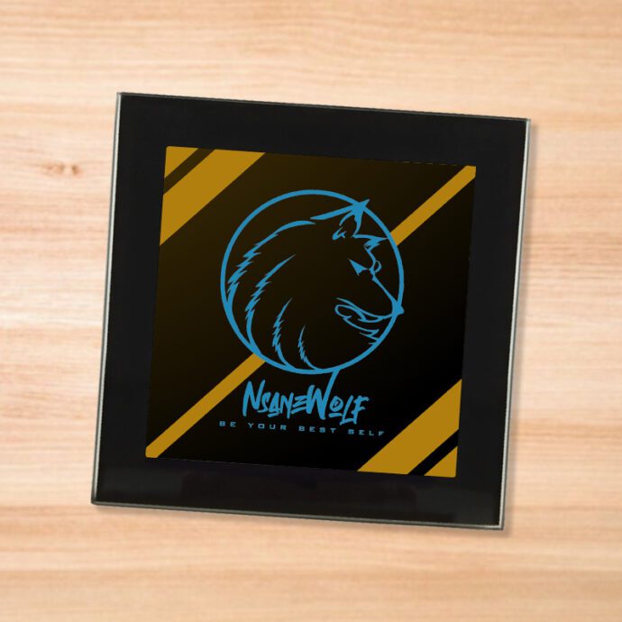 Black glass NsaneWolf - Be Your Best Self (Blue) logo coaster on a wood table
