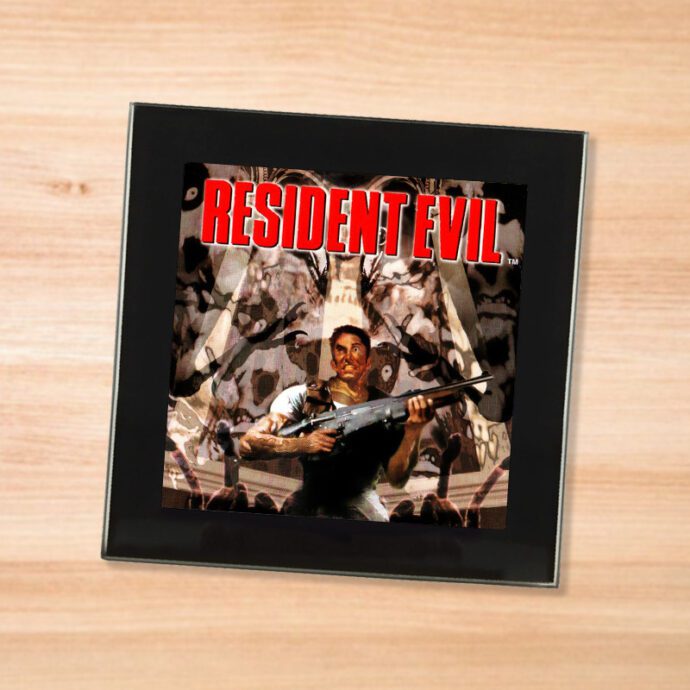 Black glass Resident Evil coaster on a wood table