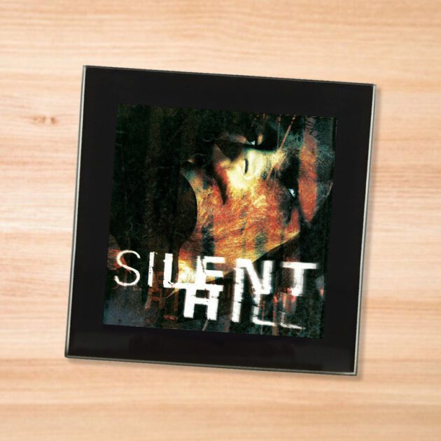 Black glass Silent Hill coaster on a wood table
