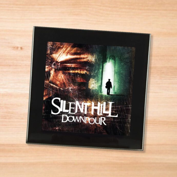 Black glass Silent Hill Downpour coaster on a wood table