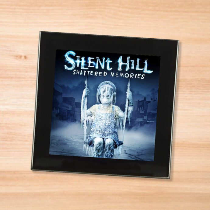 Black glass Silent Hill Shattered Memories coaster on a wood table